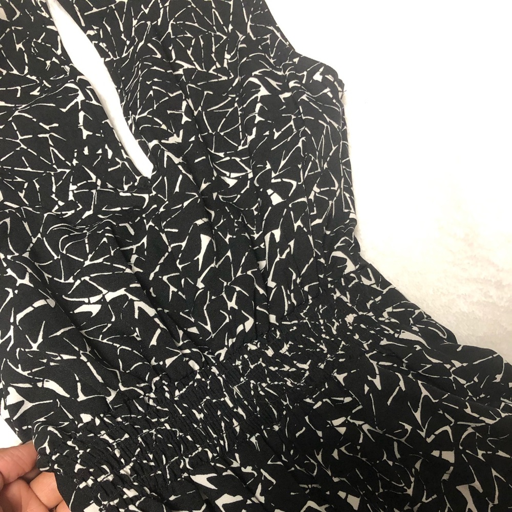 Black and white jumpsuit. Worn once. No flaws